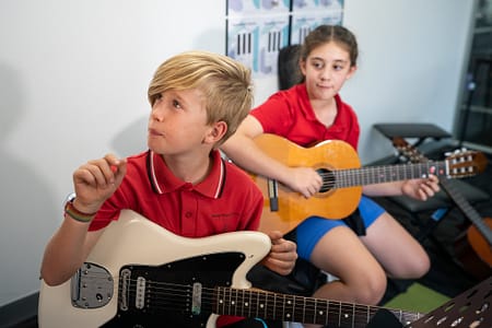 Guitar Bassie looking curious Elec gtr and Mina Guitar